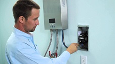 man installing a permanent powered home device